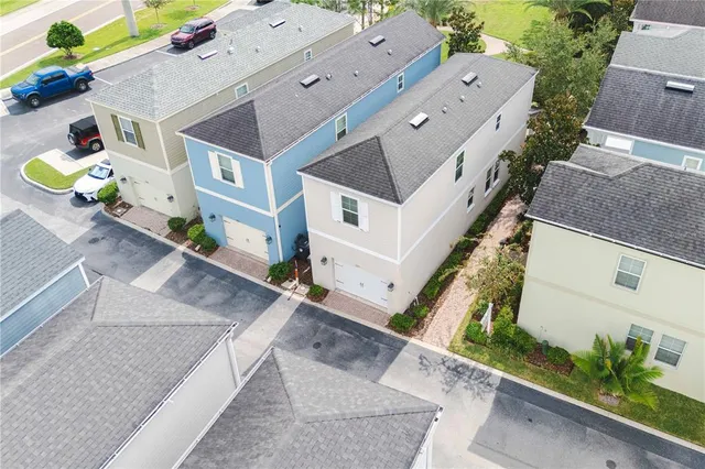 an aerial view of a house with a garden