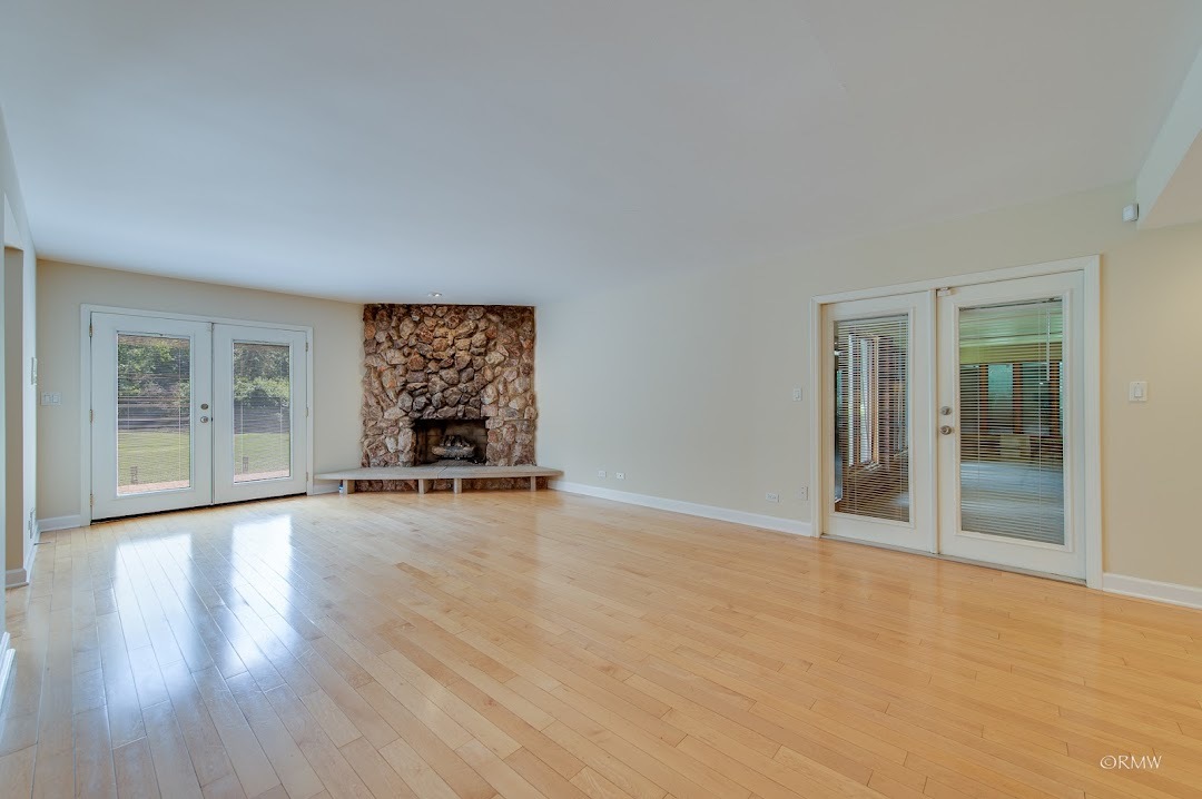 769 Halbert Lane Inverness, IL 60010 - Photo 15 of 48 a view of an empty room with wooden floor and a window