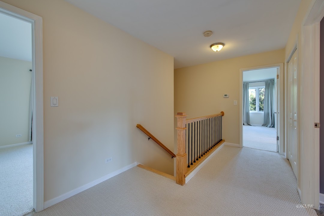769 Halbert Lane Inverness, IL 60010 - Photo 20 of 48 a view of a hallway with natural light