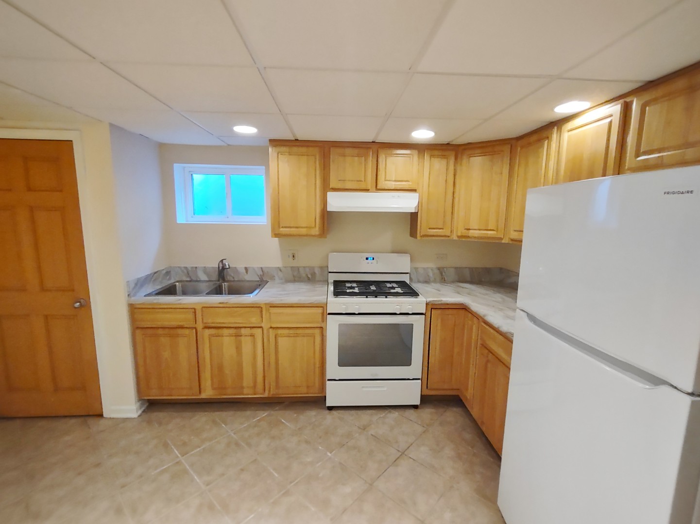 769 Halbert Lane Inverness, IL 60010 - Photo 31 of 48 a kitchen with granite countertop appliances a sink and a refrigerator