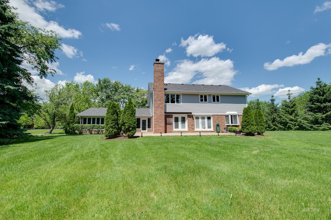 769 Halbert Lane Inverness, IL 60010 - Photo 44 of 48 a view of a big yard with a house in the background