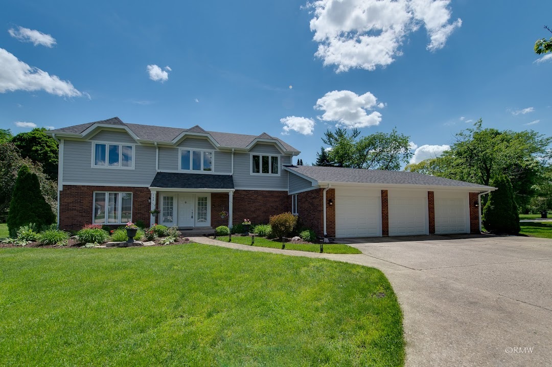 769 Halbert Lane Inverness, IL 60010 - Photo 48 of 48 a front view of a house with garden