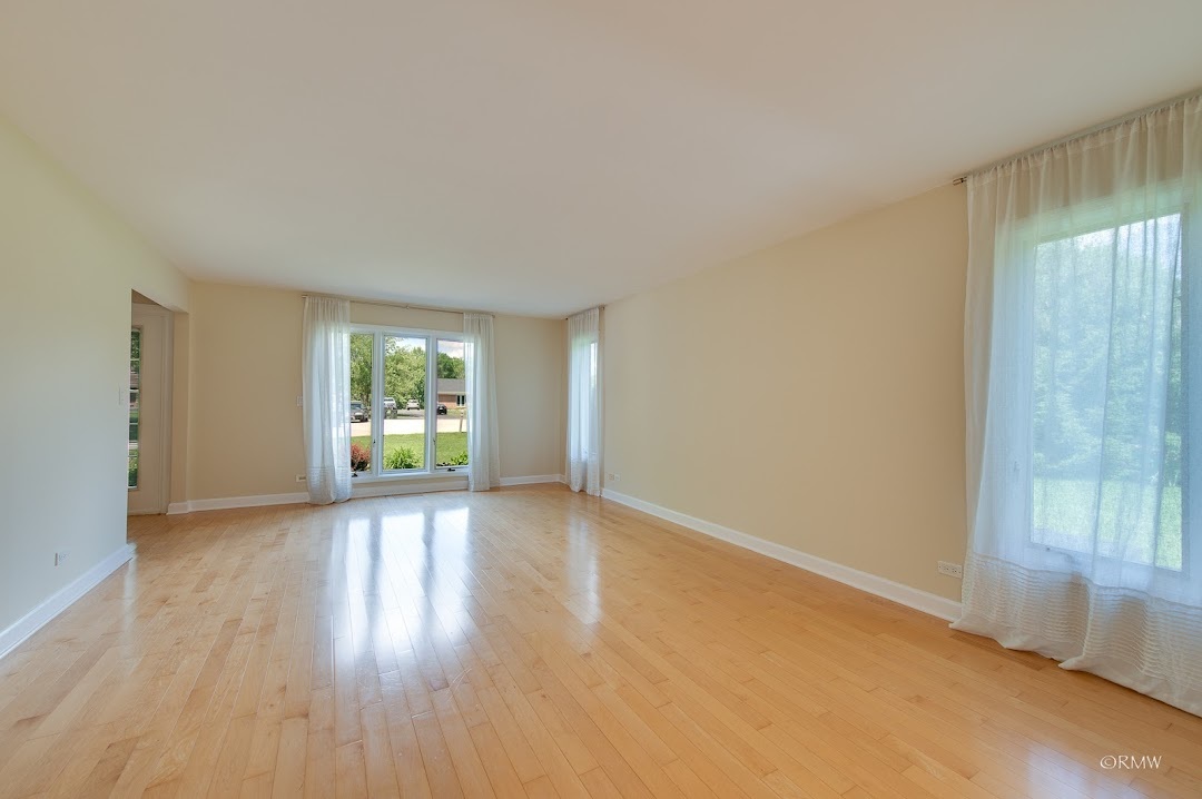 769 Halbert Lane Inverness, IL 60010 - Photo 6 of 48 an empty room with window and wooden floor