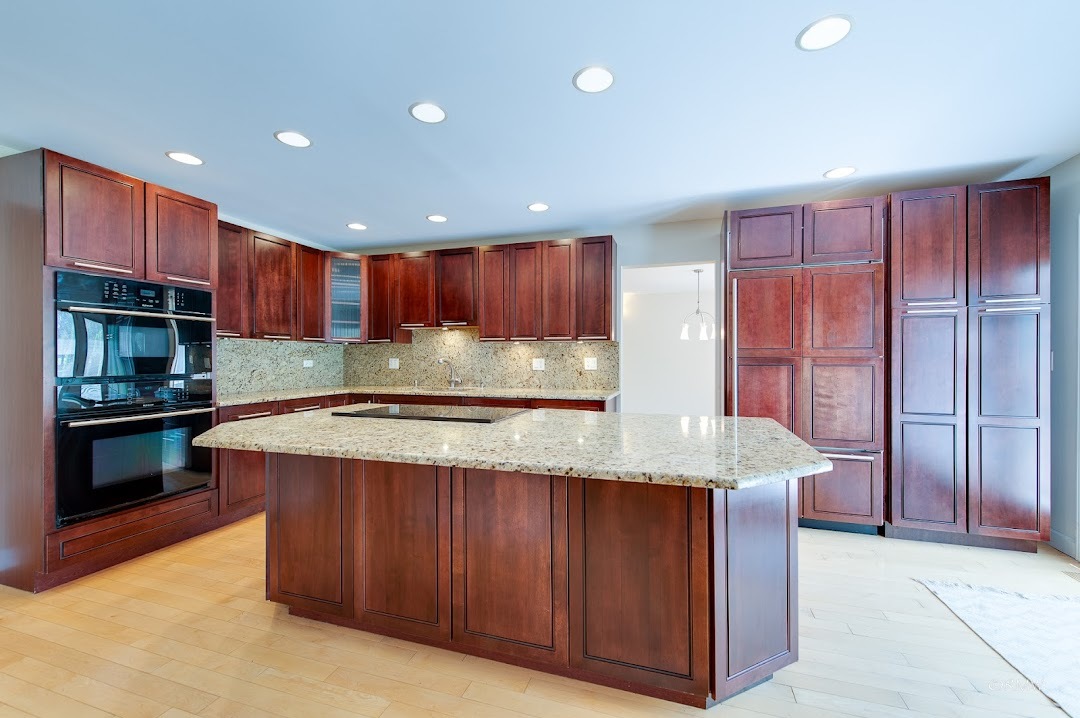 769 Halbert Lane Inverness, IL 60010 - Photo 10 of 48 a kitchen with kitchen island granite countertop wooden cabinets a oven and stainless steel appliances