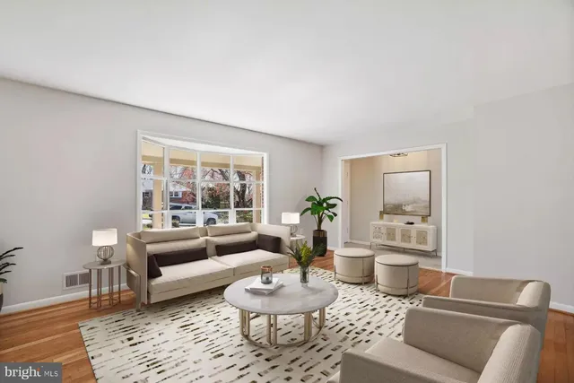 a living room with furniture and a rug