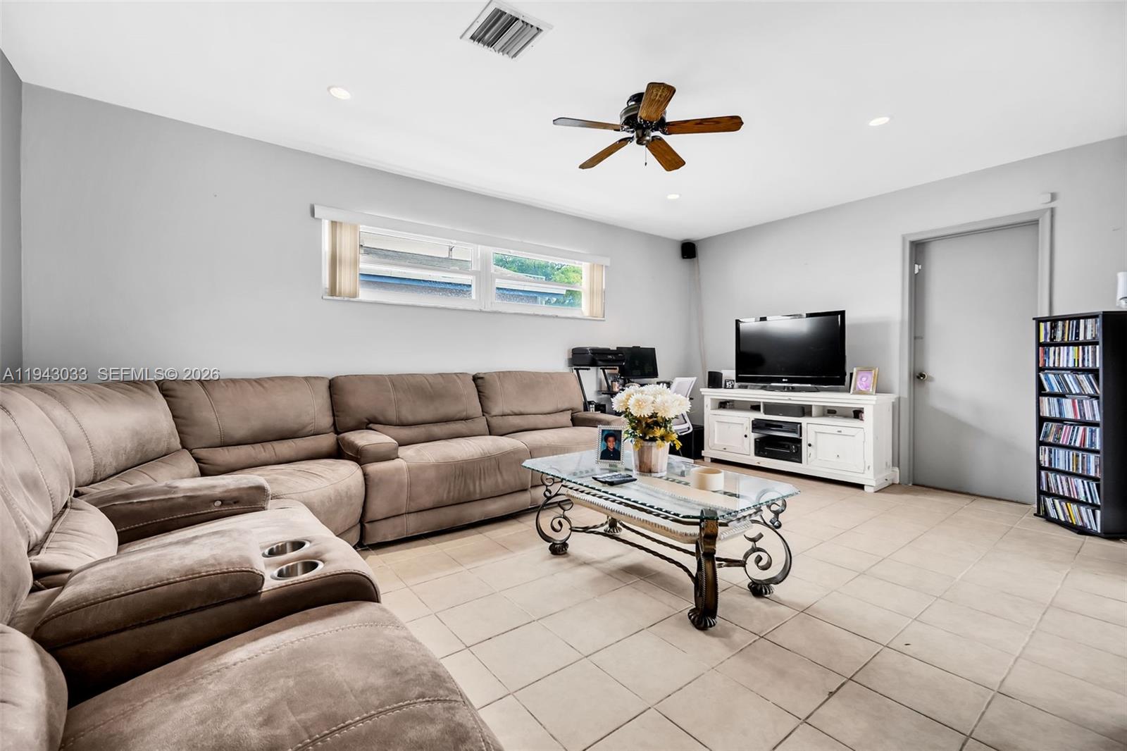 2211 North 50th Avenue Hollywood, FL 33021 - Photo 16 of 45 a living room with furniture and a flat screen tv