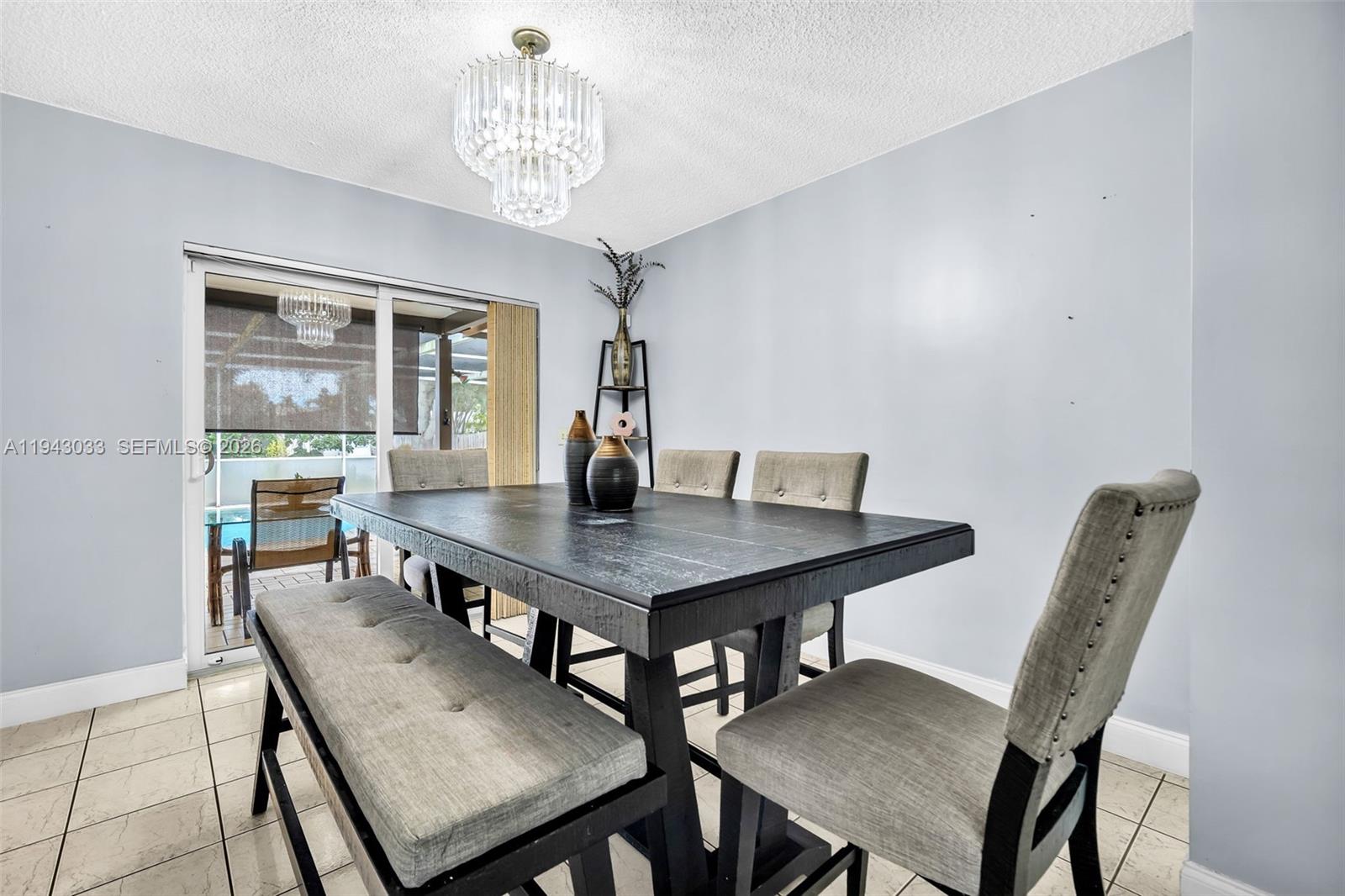 2211 North 50th Avenue Hollywood, FL 33021 - Photo 18 of 45 a view of a dining room with a table and chairs