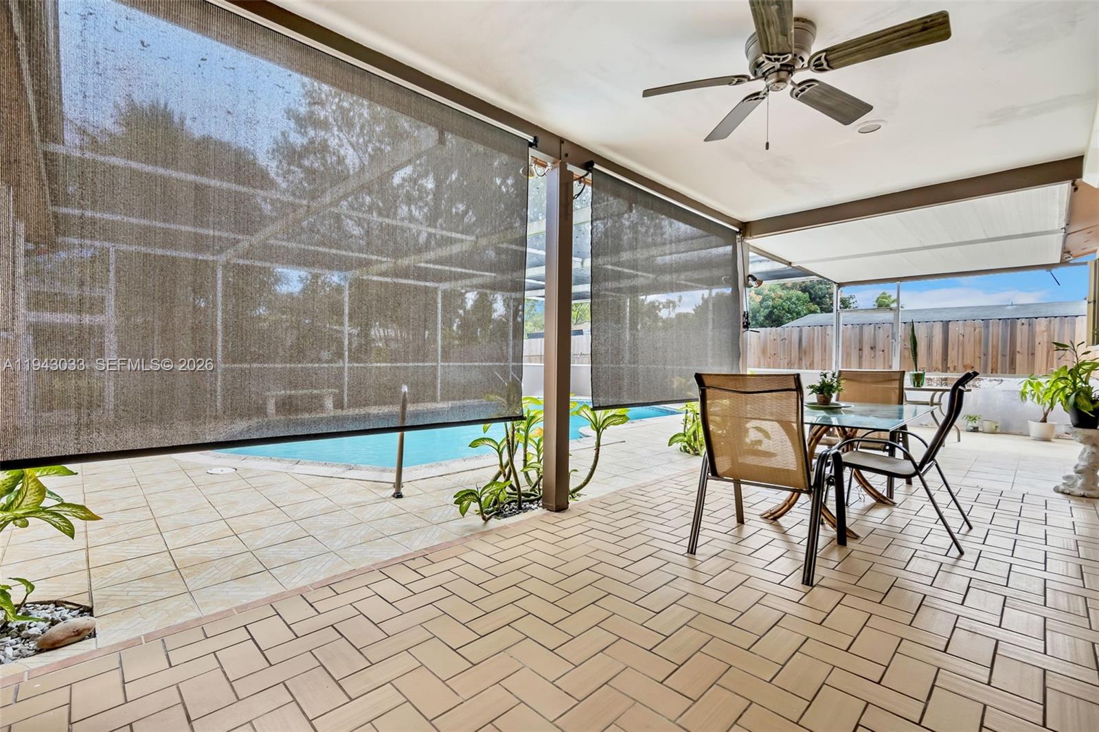 2211 North 50th Avenue Hollywood, FL 33021 - Photo 20 of 45 a view of a patio with a table and chairs