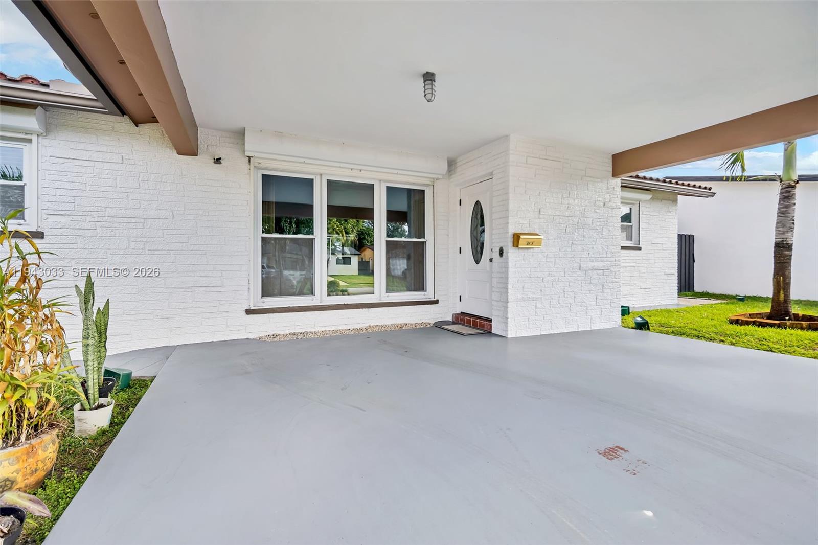 2211 North 50th Avenue Hollywood, FL 33021 - Photo 2 of 45 a view of an house with backyard and porch