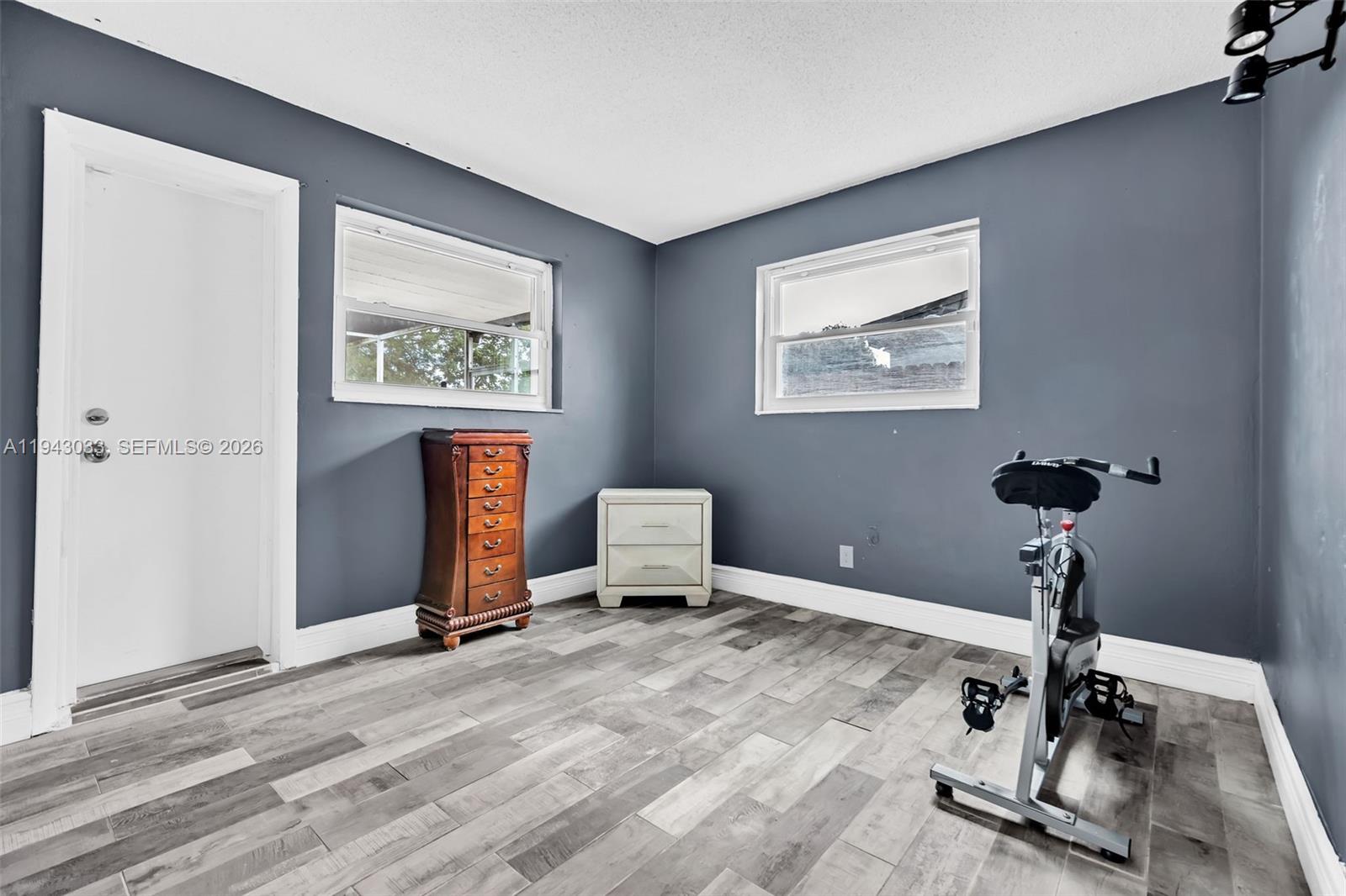 2211 North 50th Avenue Hollywood, FL 33021 - Photo 34 of 45 a room with gym equipment and a window