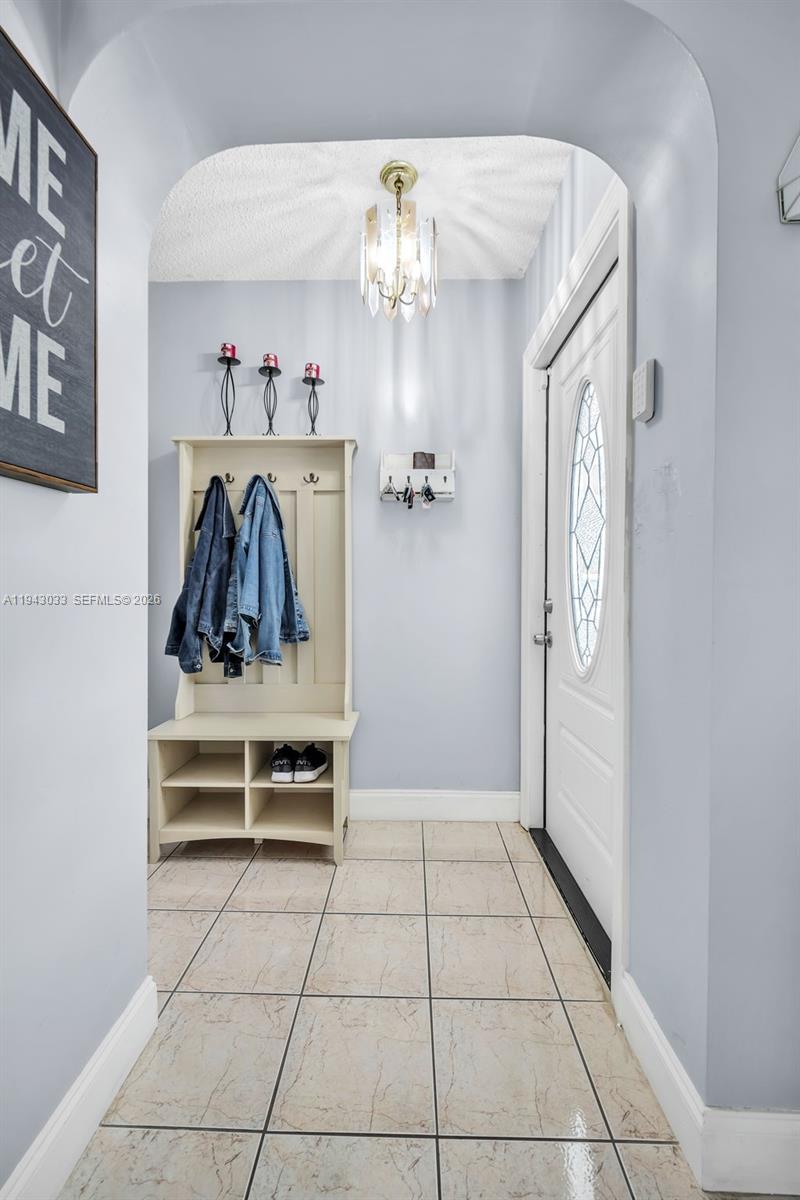2211 North 50th Avenue Hollywood, FL 33021 - Photo 4 of 45 a view of a hallway to rooms and chandelier
