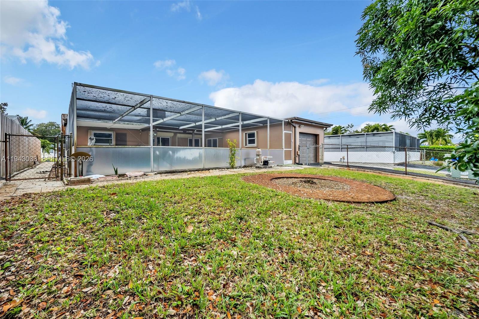 2211 North 50th Avenue Hollywood, FL 33021 - Photo 41 of 45 a view of a house with a yard patio and sitting area