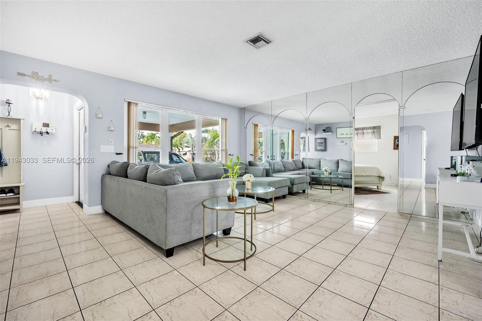 2211 North 50th Avenue Hollywood, FL 33021 - Photo 8 of 45 a living room with furniture and a large window