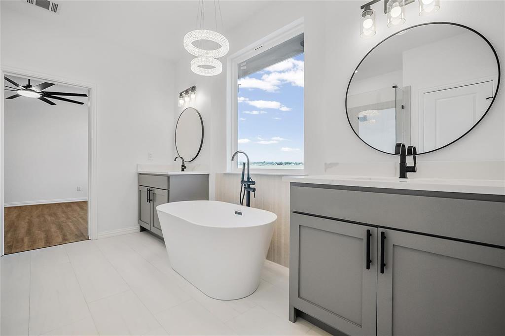 3093 Willow Road Celeste, TX 75423 - Photo 29 of 40 a bathroom with a sink and a mirror