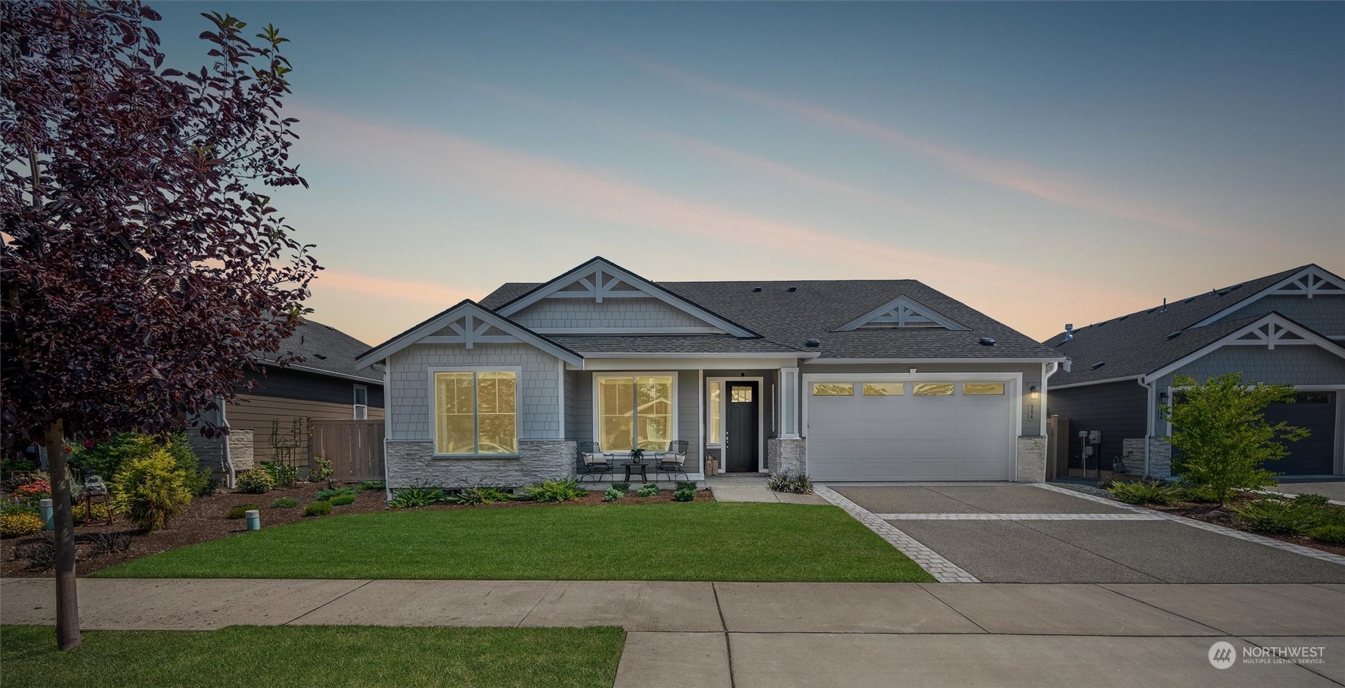 a front view of a house with a garden