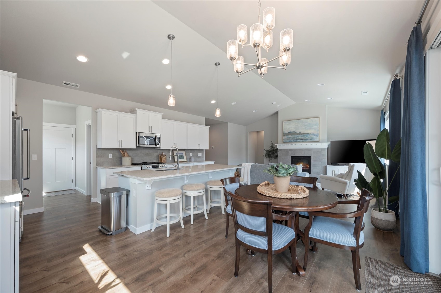984 Rainier Loop Mount Vernon, WA 98274 - Photo 16 of 40 a view of a dining room with furniture a kitchen and chandelier