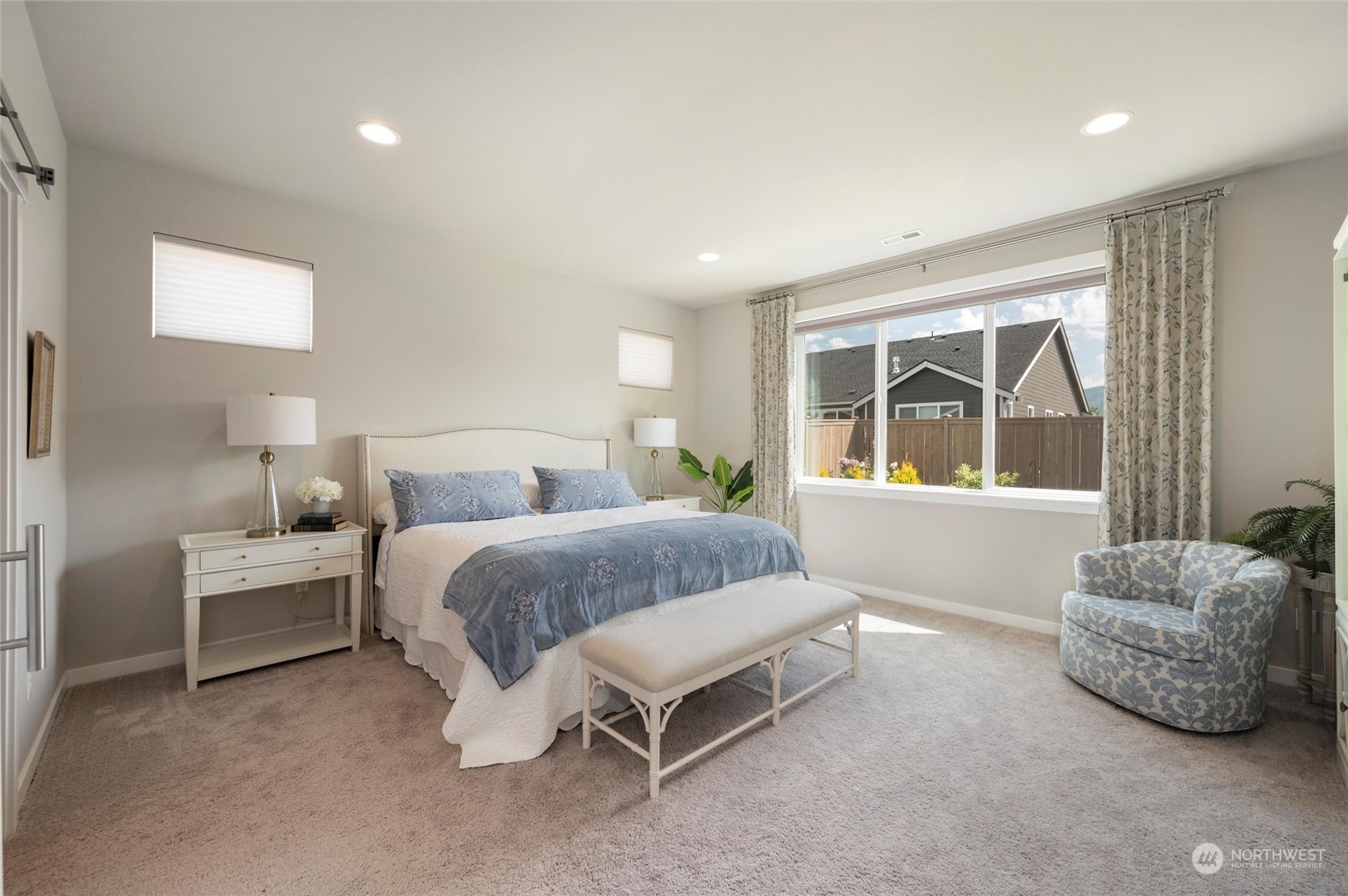 984 Rainier Loop Mount Vernon, WA 98274 - Photo 19 of 40 a spacious bedroom with a bed and window