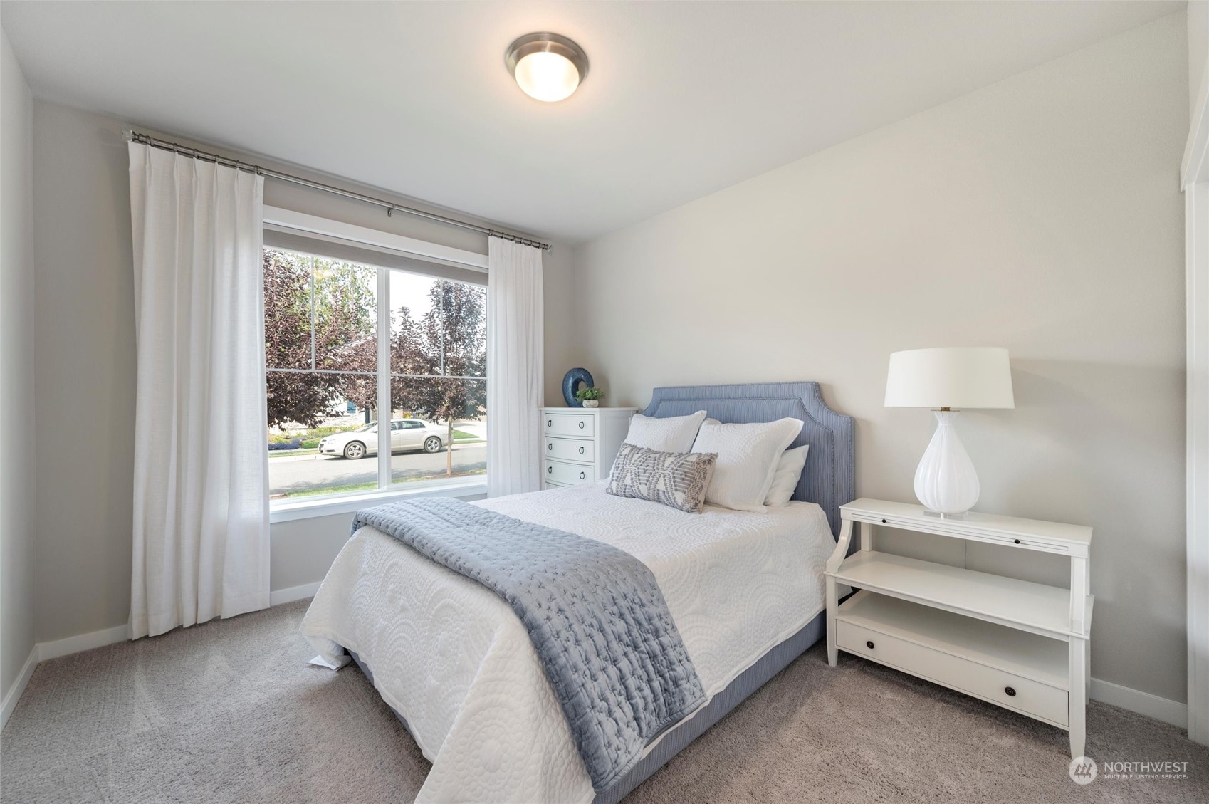 984 Rainier Loop Mount Vernon, WA 98274 - Photo 24 of 40 a bedroom with a bed and a large window