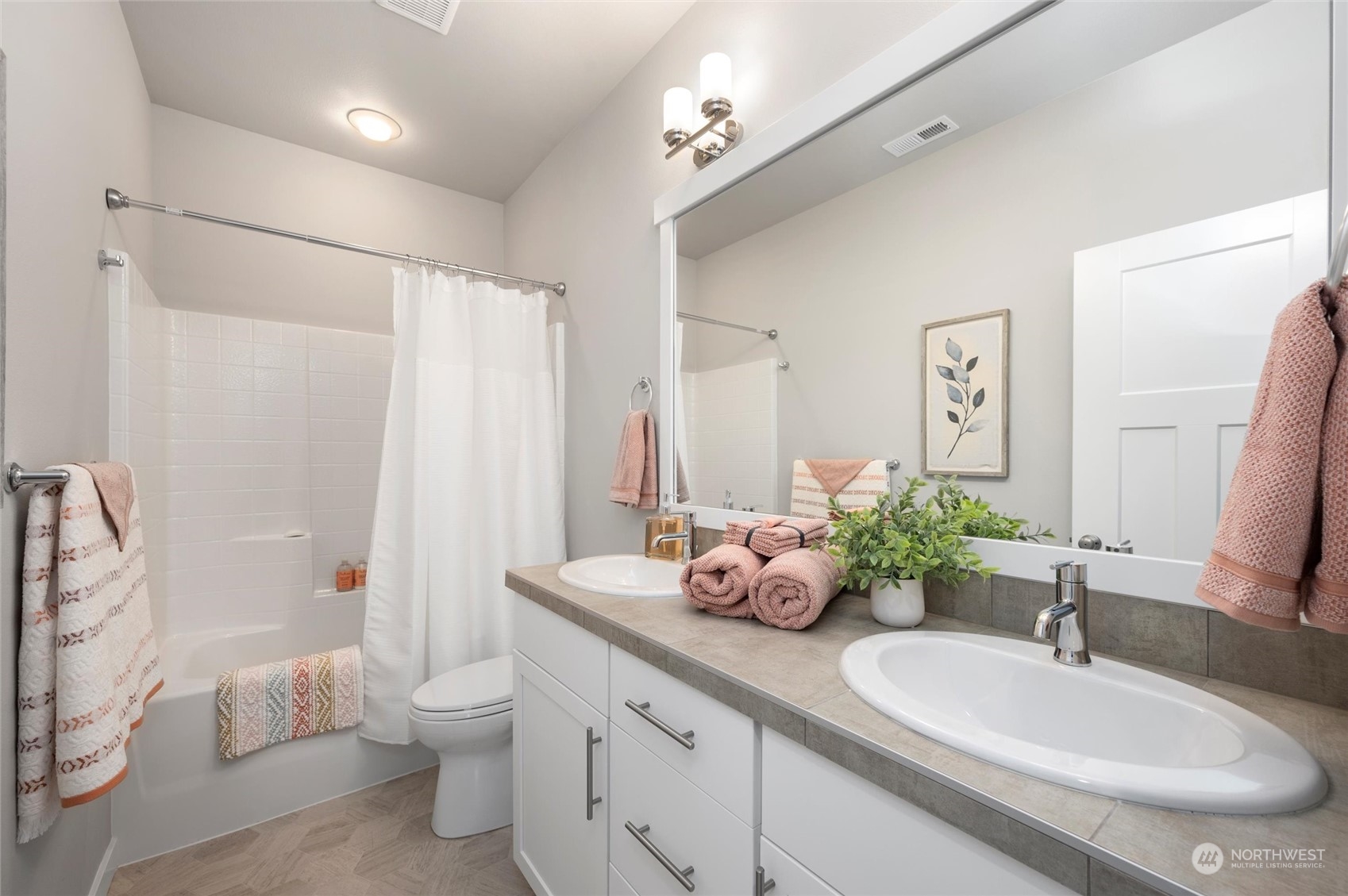 984 Rainier Loop Mount Vernon, WA 98274 - Photo 26 of 40 a bathroom with a granite countertop sink mirror vanity and toilet