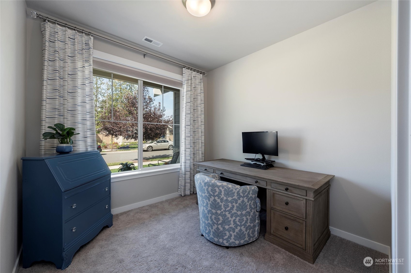 984 Rainier Loop Mount Vernon, WA 98274 - Photo 28 of 40 a living room with furniture and a flat screen tv