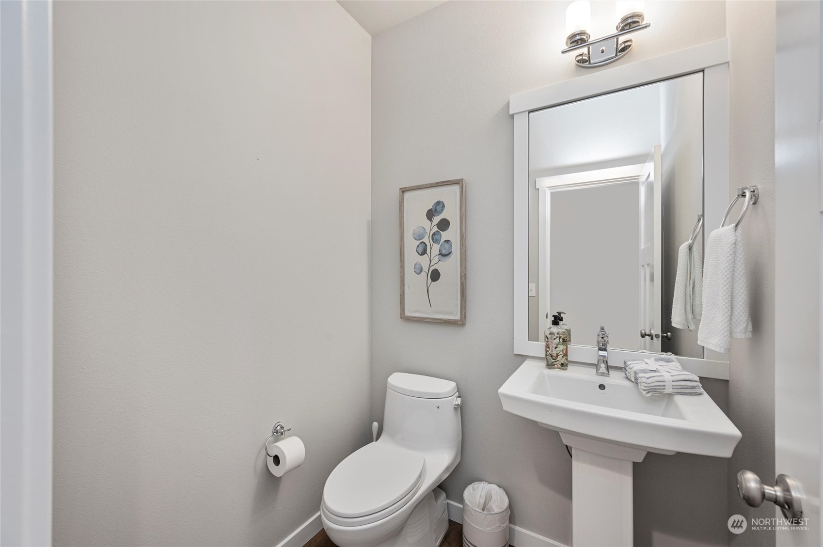 984 Rainier Loop Mount Vernon, WA 98274 - Photo 29 of 40 a bathroom with a toilet a sink and mirror