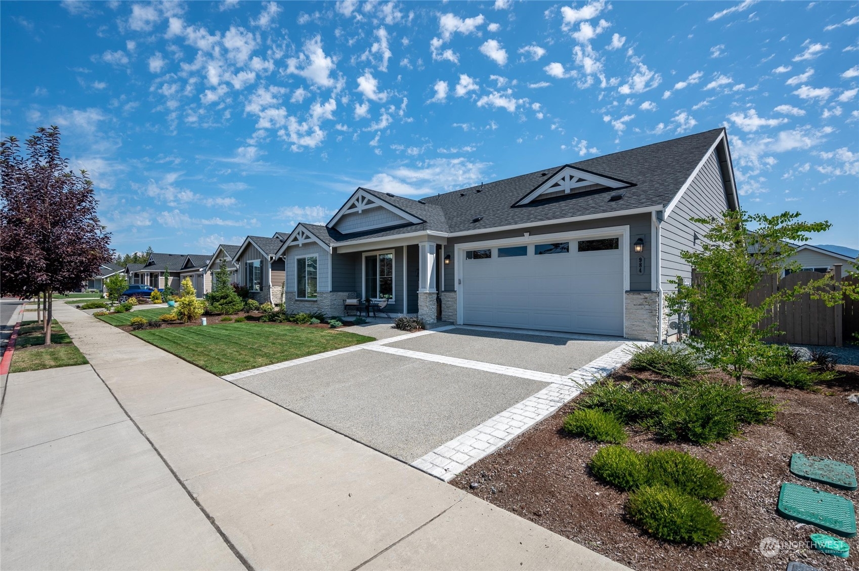 984 Rainier Loop Mount Vernon, WA 98274 - Photo 3 of 40 a front view of a house with a garden
