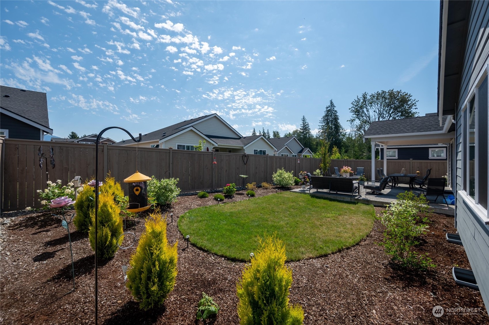 984 Rainier Loop Mount Vernon, WA 98274 - Photo 35 of 40 a view of a house with backyard and sitting area