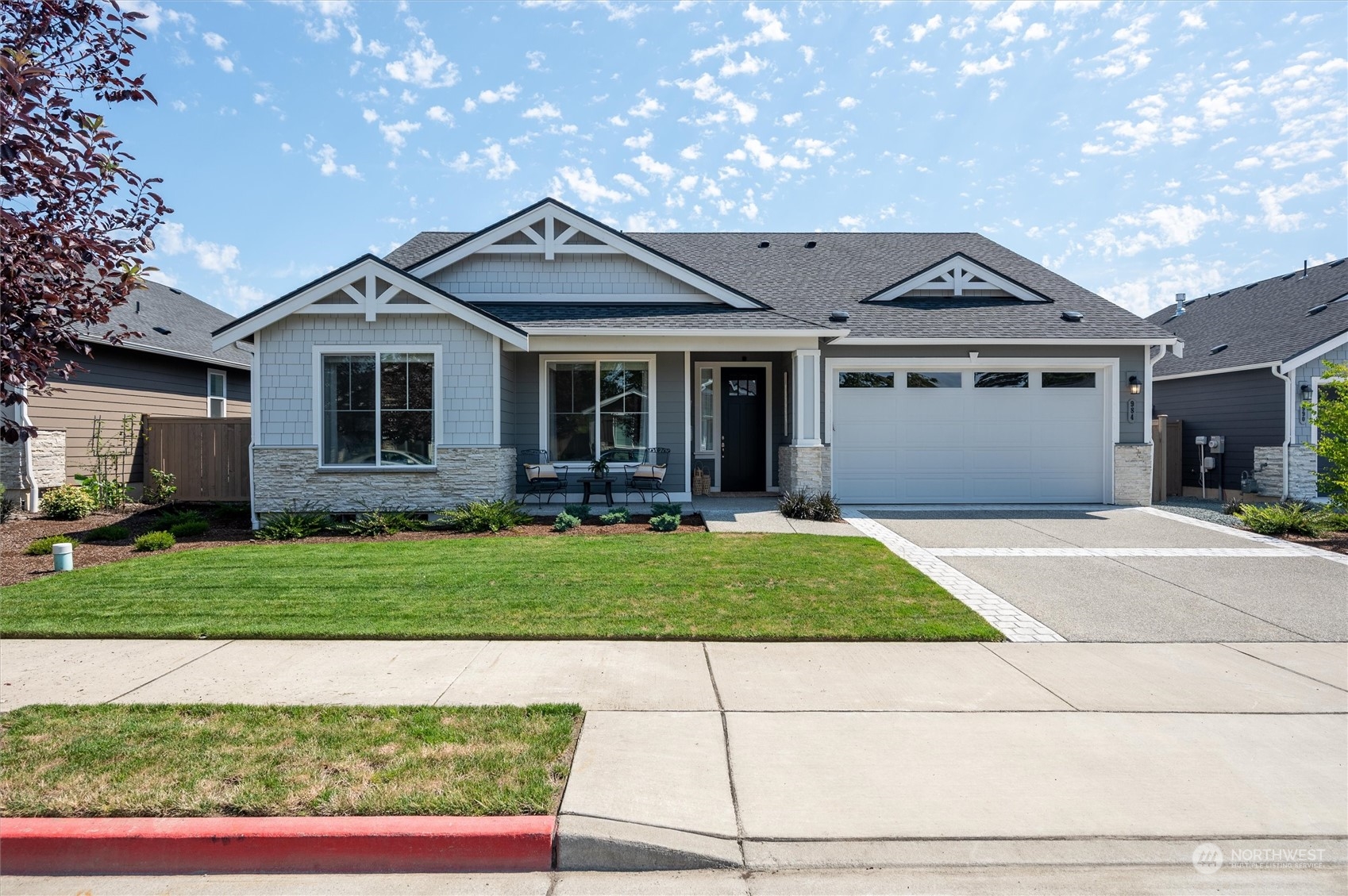 984 Rainier Loop Mount Vernon, WA 98274 - Photo 36 of 40 a front view of a house with a garden and pathway
