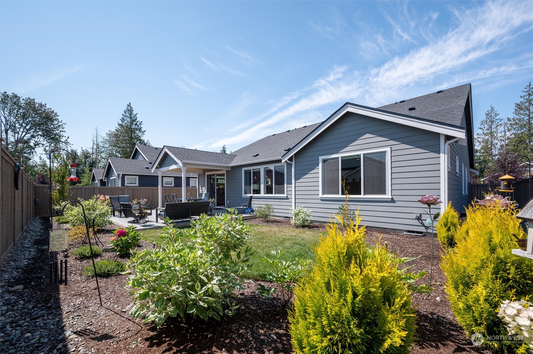 984 Rainier Loop Mount Vernon, WA 98274 - Photo 37 of 40 a front view of house with yard and trees in the background