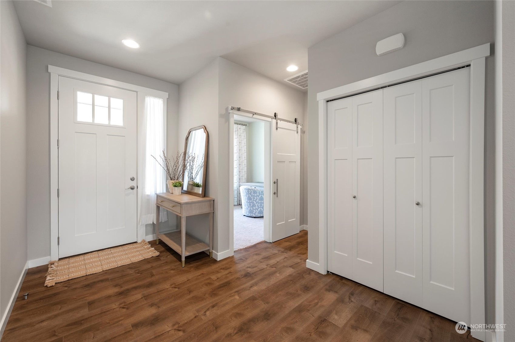 984 Rainier Loop Mount Vernon, WA 98274 - Photo 7 of 40 a view of an empty room with window and wooden floor
