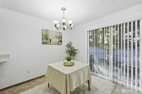 a view of a hallway with a chandelier