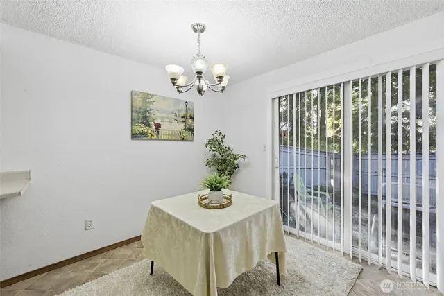 a view of a hallway with a chandelier