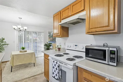a kitchen with a stove and a microwave
