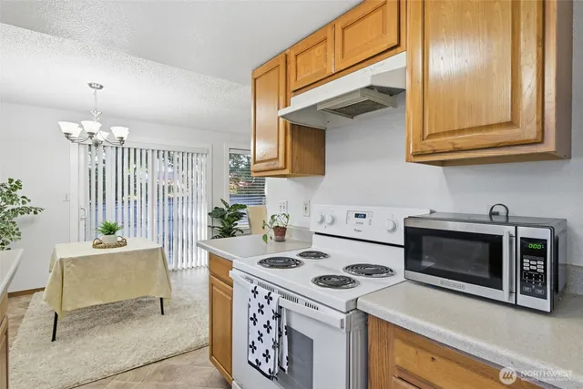 a kitchen with a stove and a microwave