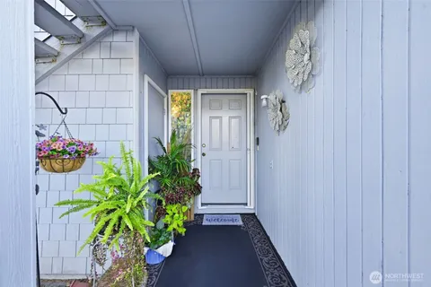 a view of a entryway with flower pots