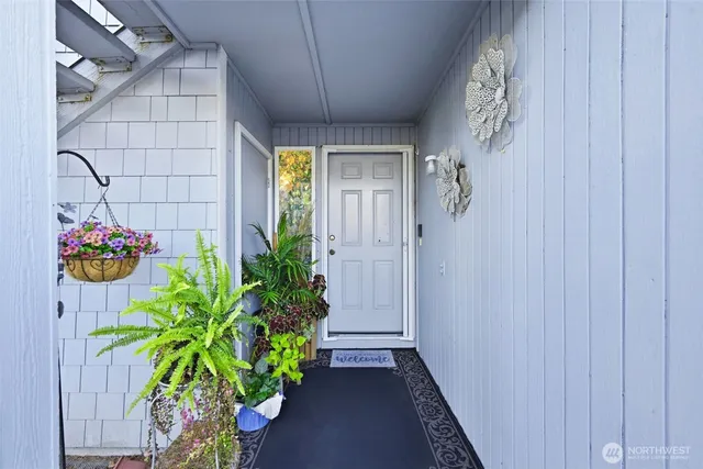a view of a entryway with flower pots