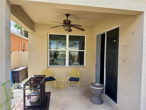 a view of a workspace with furniture and windows