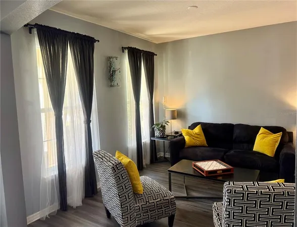 a living room with furniture and a window