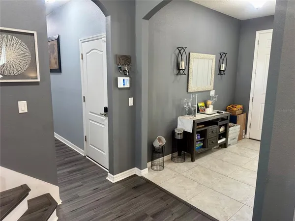 a room with a bed and a mirror