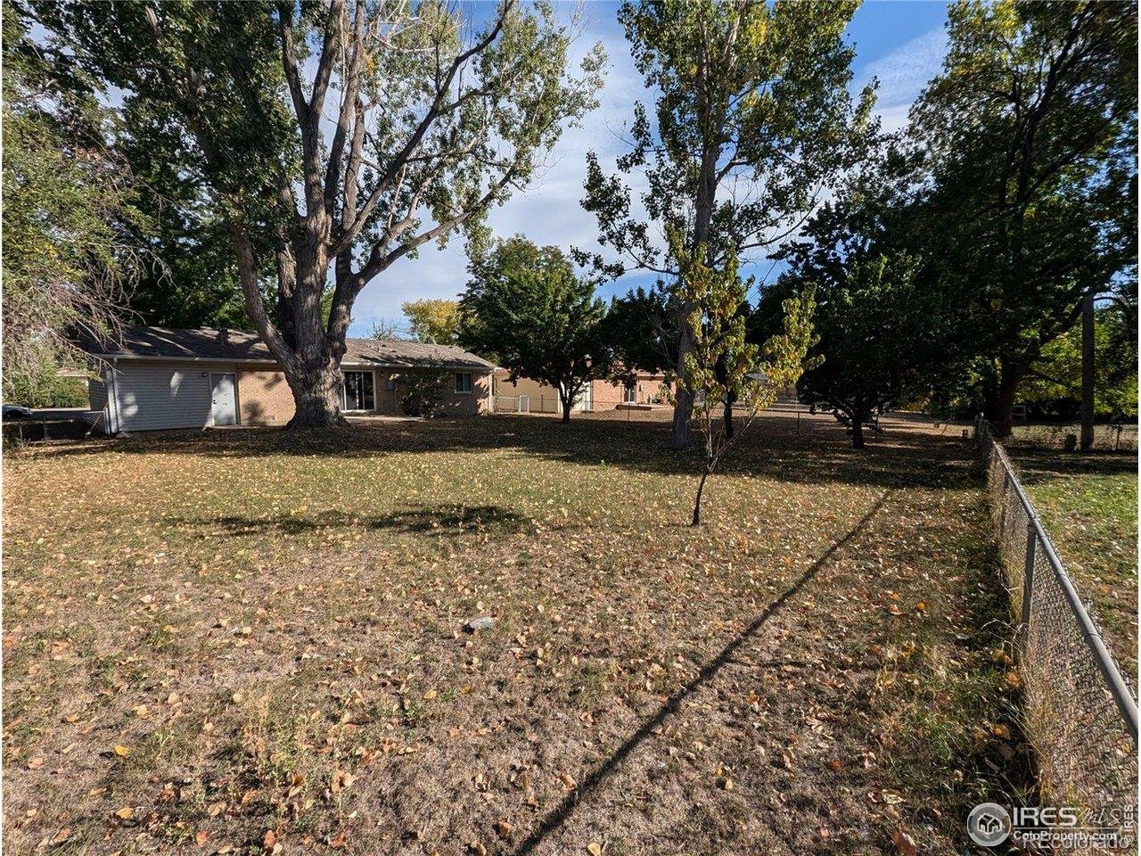 805 Gallup Road Fort Collins, CO 80521 - Photo 14 of 14 a view of a yard with wooden fence
