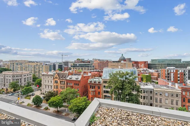a view of a city with tall buildings