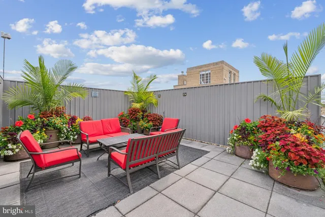 a view of a terrace with furniture and stove