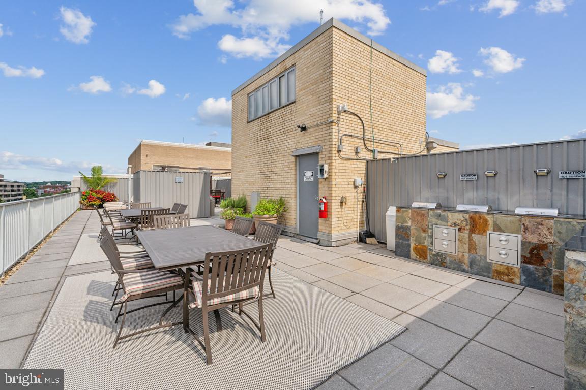 1711 Massachusetts Avenue Northwest, Unit 413 Washington, DC 20036 - Photo 17 of 20 a view of a dinning table and chairs in the patio