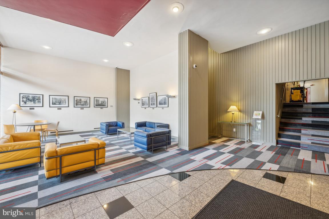 1711 Massachusetts Avenue Northwest, Unit 413 Washington, DC 20036 - Photo 19 of 20 a bedroom with furniture and a flat screen tv