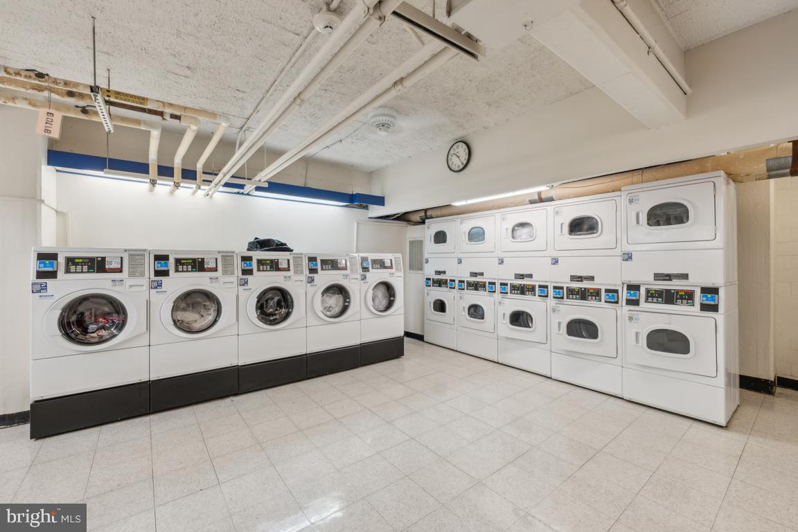 1711 Massachusetts Avenue Northwest, Unit 413 Washington, DC 20036 - Photo 20 of 20 a utility room with stainless steel appliances and cabinets