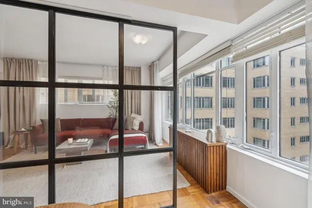 a view of an empty room with a floor to ceiling window