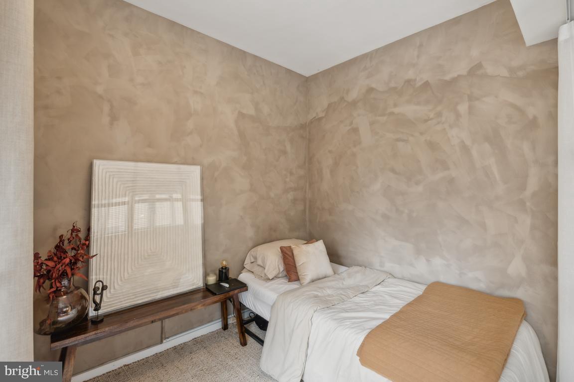 1711 Massachusetts Avenue Northwest, Unit 413 Washington, DC 20036 - Photo 6 of 20 a bedroom with a bed and a window