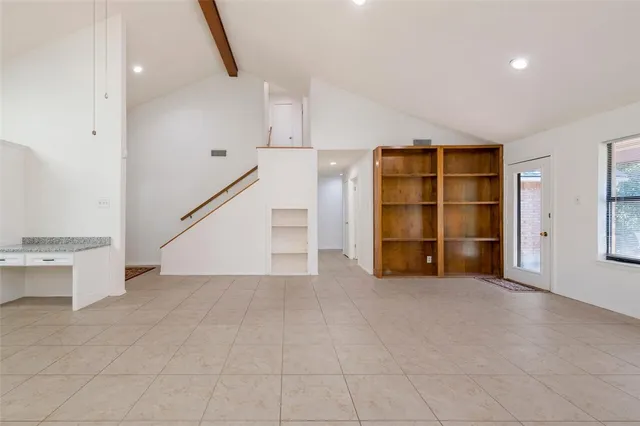a kitchen with a sink a counter top space and appliances