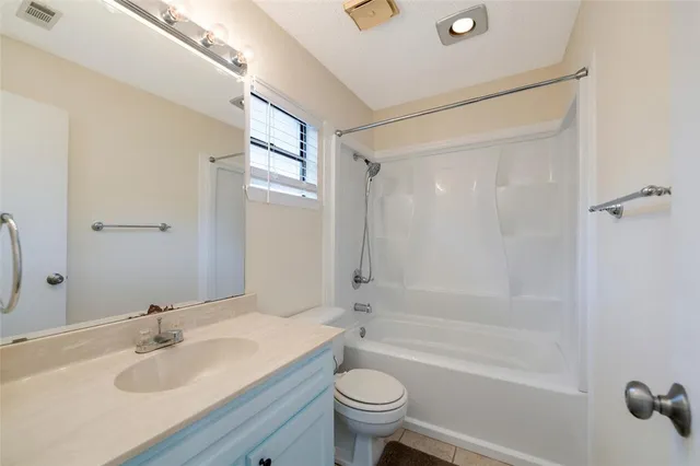 a bathroom with a window and a shower