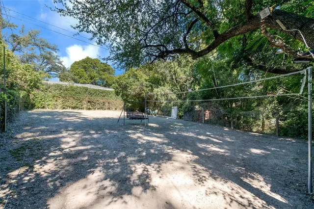 an aerial view of residential houses with city view